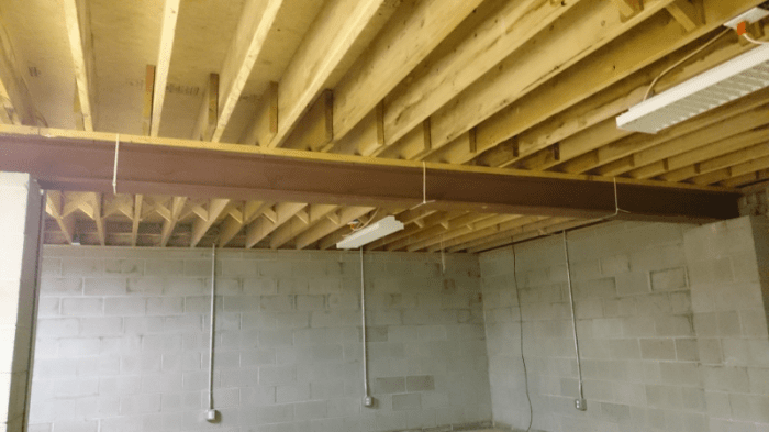 Steel beam supporting floor joists